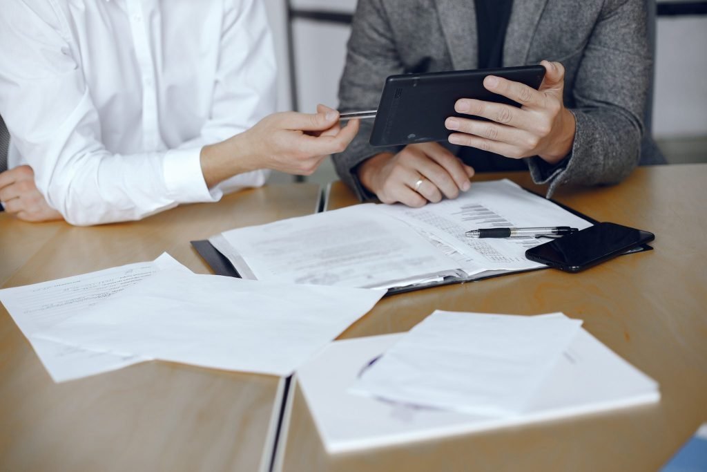 business-men-sitting-lawyers-s-desk-people-signing-important-documents-2048x1365